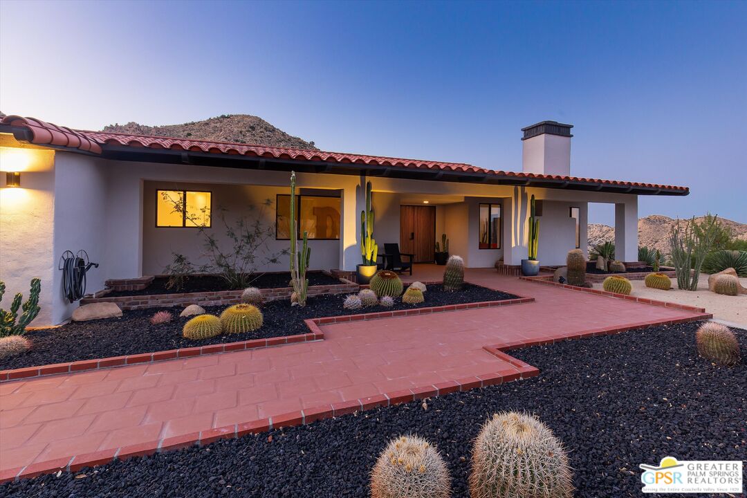 53744 Ridge Road Yucca Valley, CA 92284 - Photo 4 of 39 a view of a house with patio outdoor seating