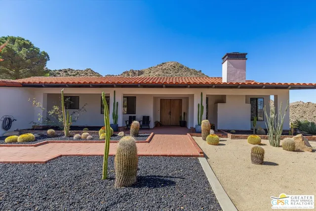 a front view of a house with patio