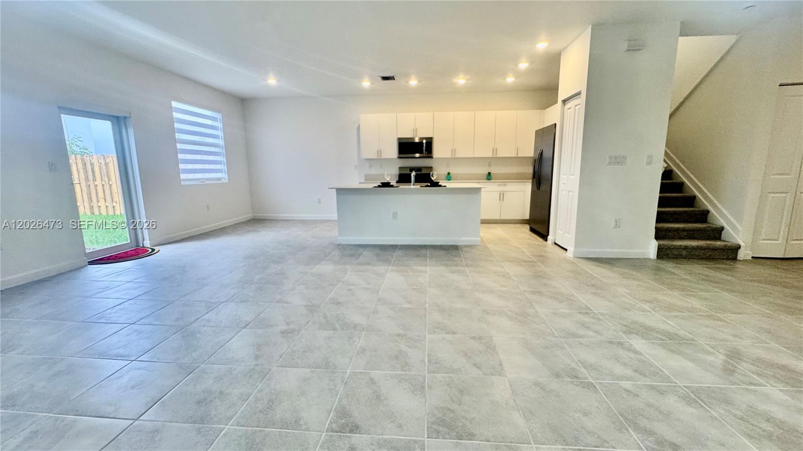 19479 Southwest 340th Street, Unit 1 Homestead, FL 33034 - Photo 56 of 58 a view of a kitchen with furniture and a kitchen
