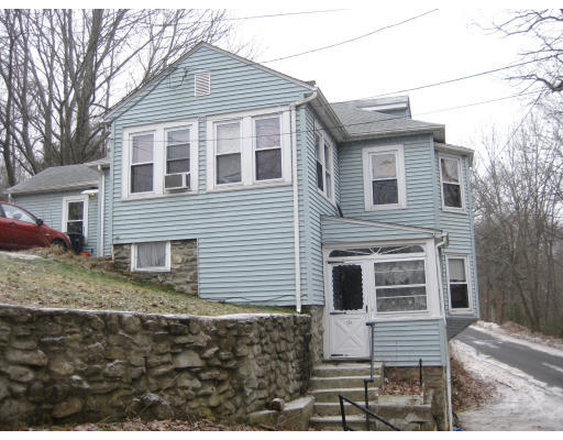 a view of a house with large windows