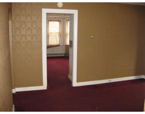 17 South Sturbridge Road Charlton, MA 01507 - Photo 11 of 26 an empty room with wooden floor and windows
