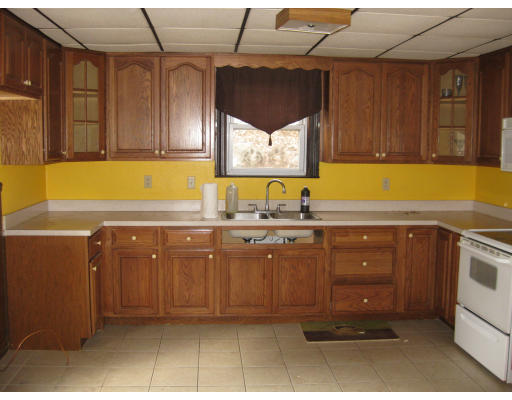 17 South Sturbridge Road Charlton, MA 01507 - Photo 2 of 26 a kitchen with sink cabinets and window