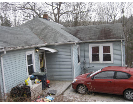 17 South Sturbridge Road Charlton, MA 01507 - Photo 23 of 26 a front view of a house with parking