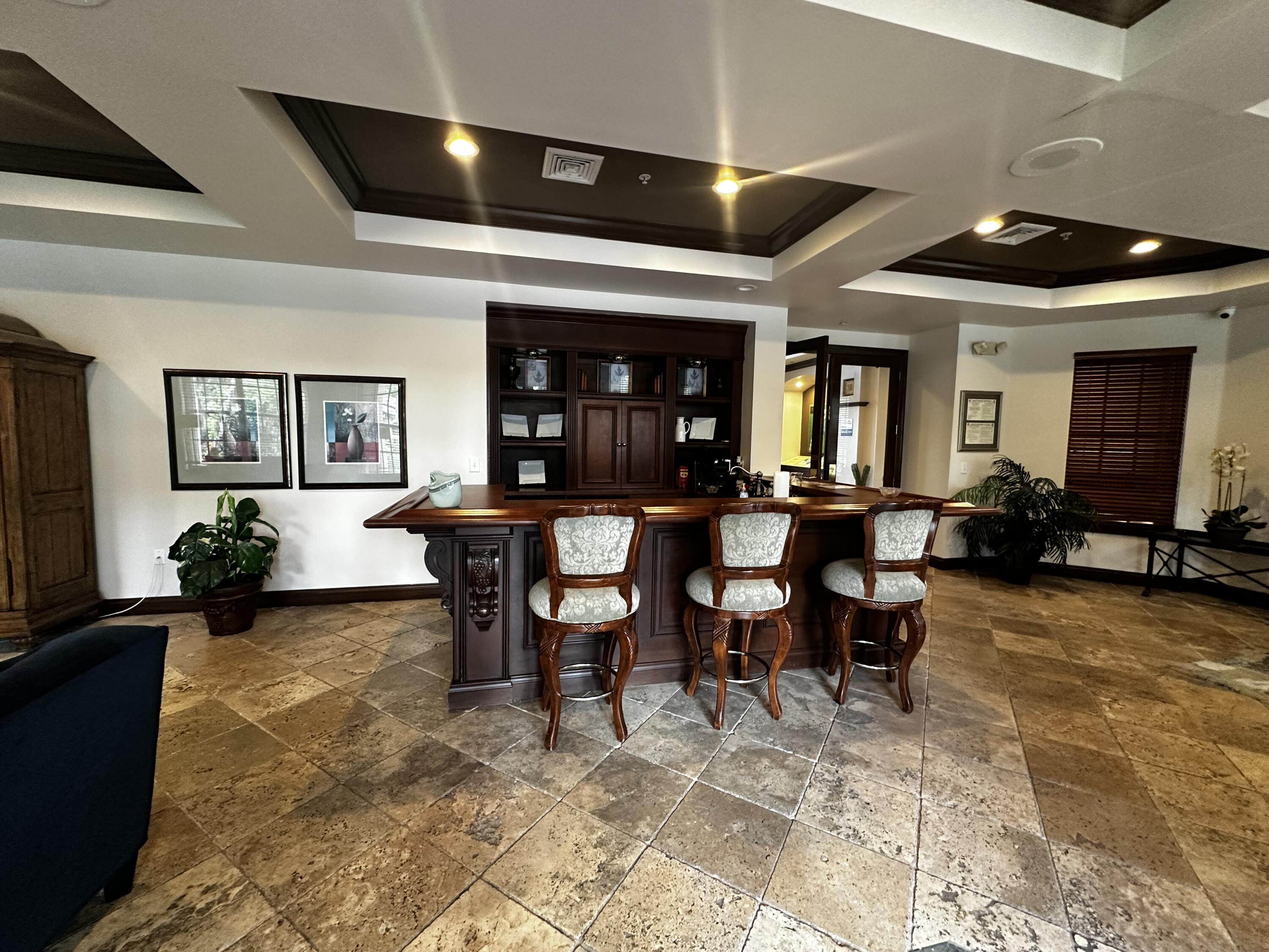 3615 Northwest Mediterranean Lane, Unit 13205 Jensen Beach, FL 34957 - Photo 13 of 14 a view of a dining room with furniture