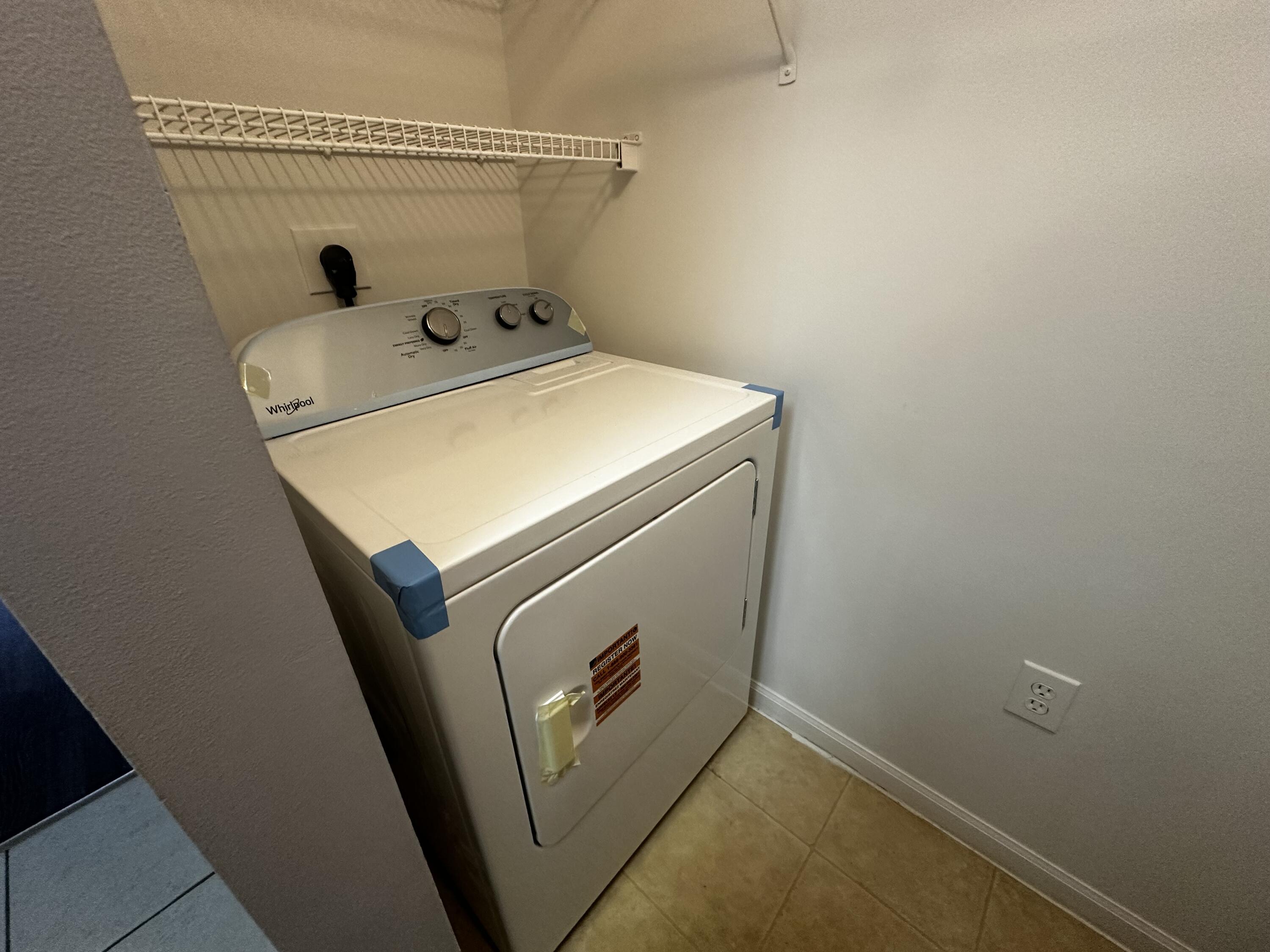 3615 Northwest Mediterranean Lane, Unit 13205 Jensen Beach, FL 34957 - Photo 10 of 14 a utility room with dryer and washer