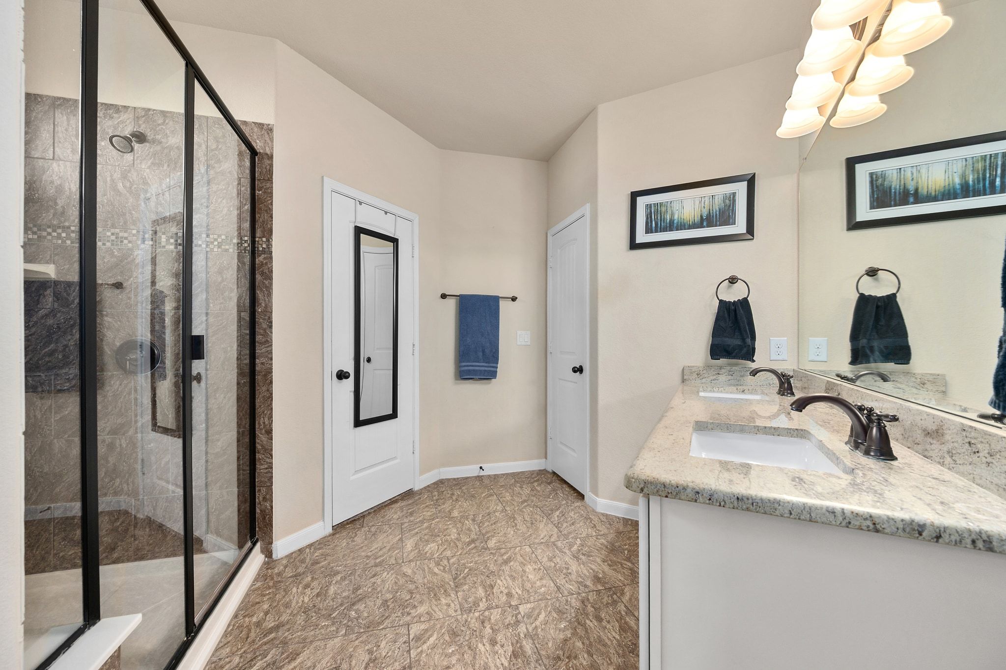 738 Palo Duro Loop Round Rock, TX 78664 - Photo 13 of 32 A dual vanity in the primary ensuite provides you with abundant storage space.