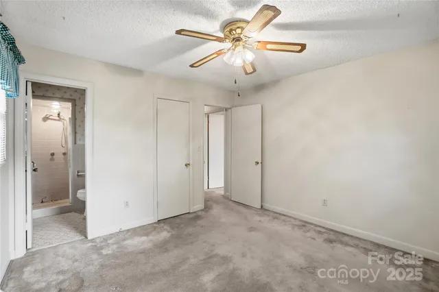 a bathroom with a toilet and shower