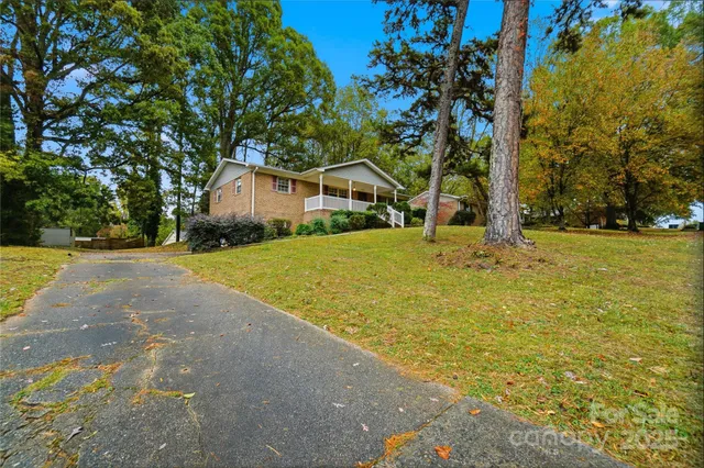 a house with swimming pool in front of it