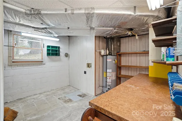 a view of house with backyard and trees