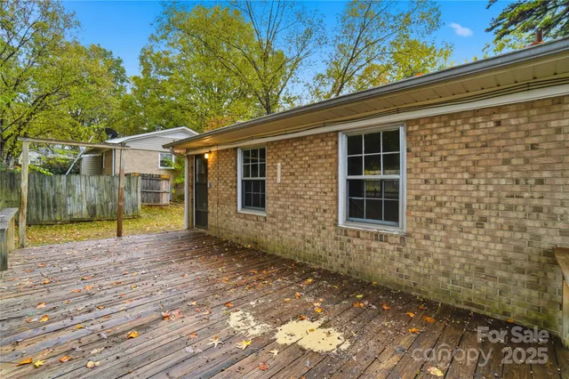 a front view of a house with yard and green space