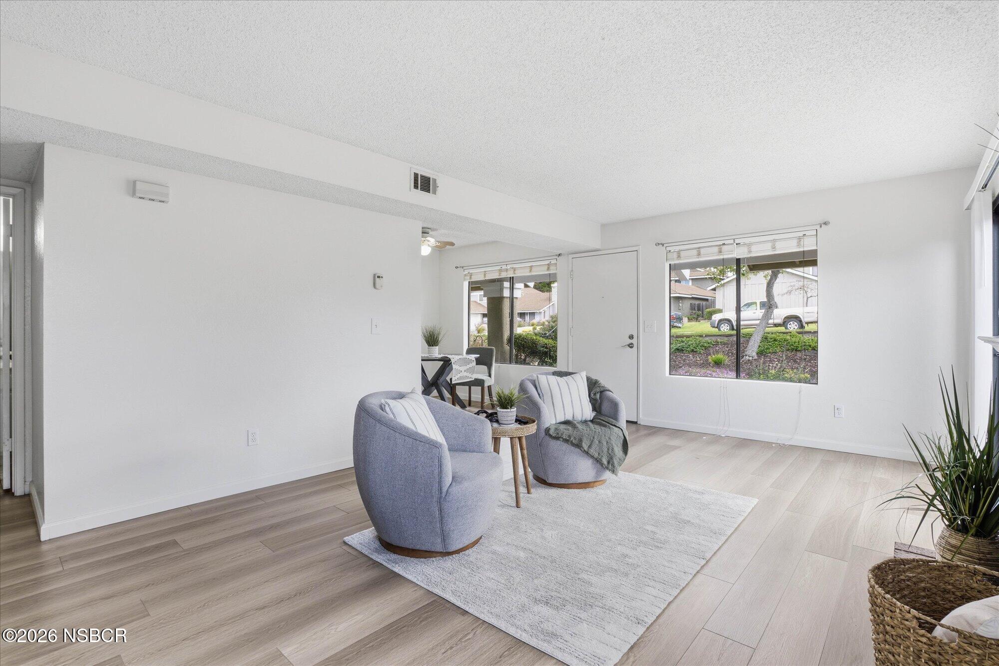 1192 Sumner Place, Unit D Santa Maria, CA 93455 - Photo 4 of 18 a living room with furniture and a large window