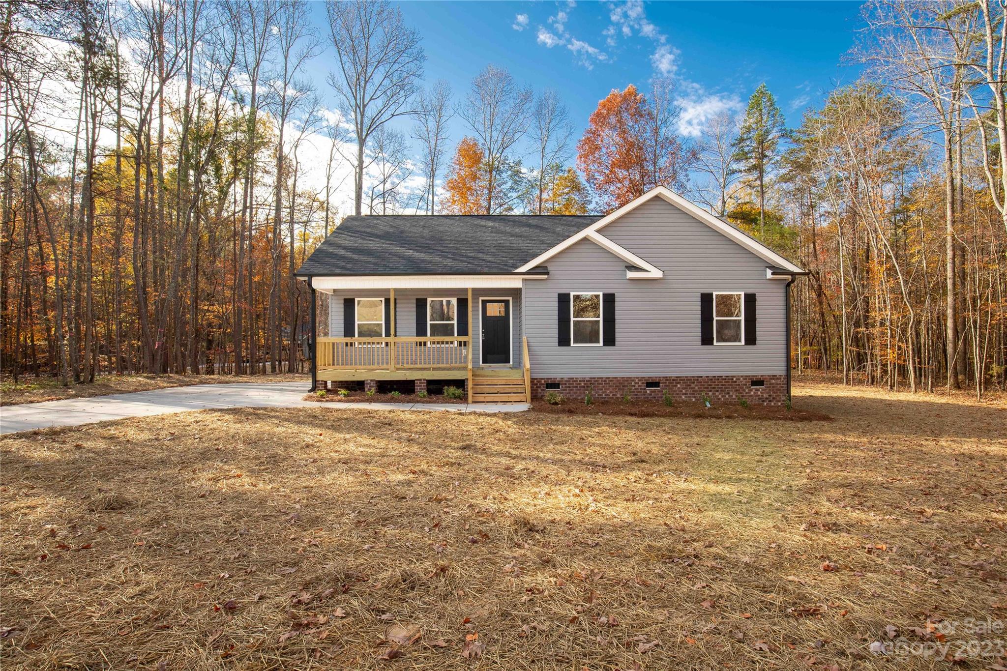 a house with trees in the background