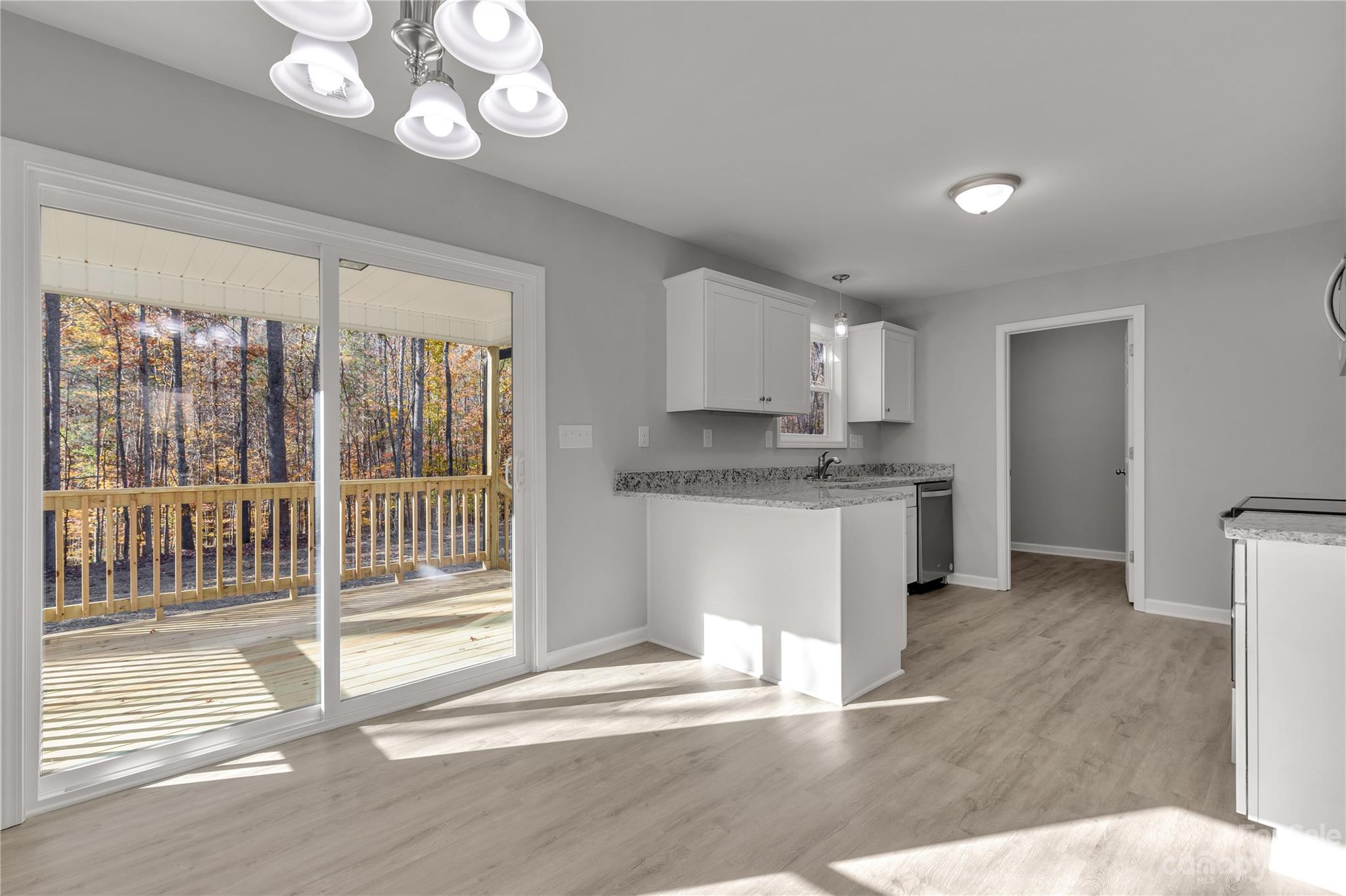 1191 Legion Road Hickory Grove, SC 29717 - Photo 13 of 32 a kitchen with a refrigerator and a sink