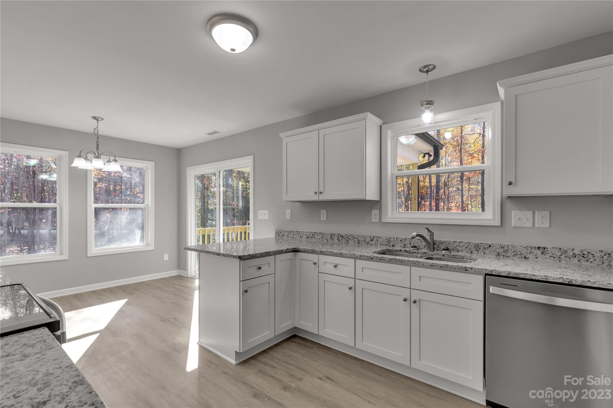 1191 Legion Road Hickory Grove, SC 29717 - Photo 17 of 32 a kitchen with a sink stove and cabinets
