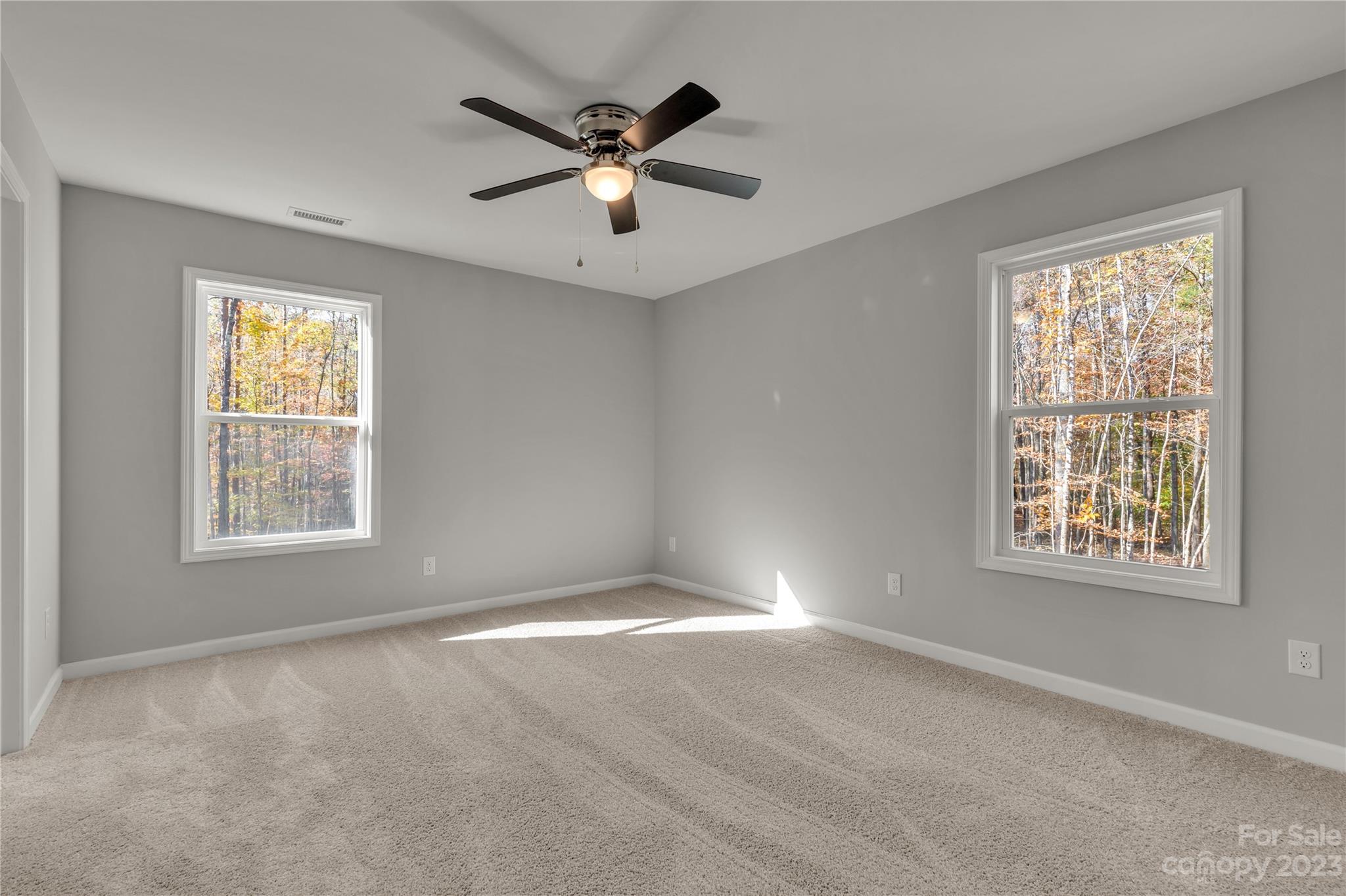 1191 Legion Road Hickory Grove, SC 29717 - Photo 24 of 32 an empty room with windows and fan