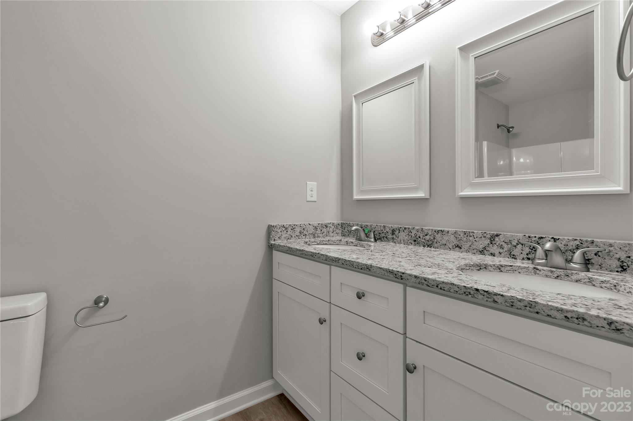 1191 Legion Road Hickory Grove, SC 29717 - Photo 26 of 32 a bathroom with a granite countertop sink and a mirror