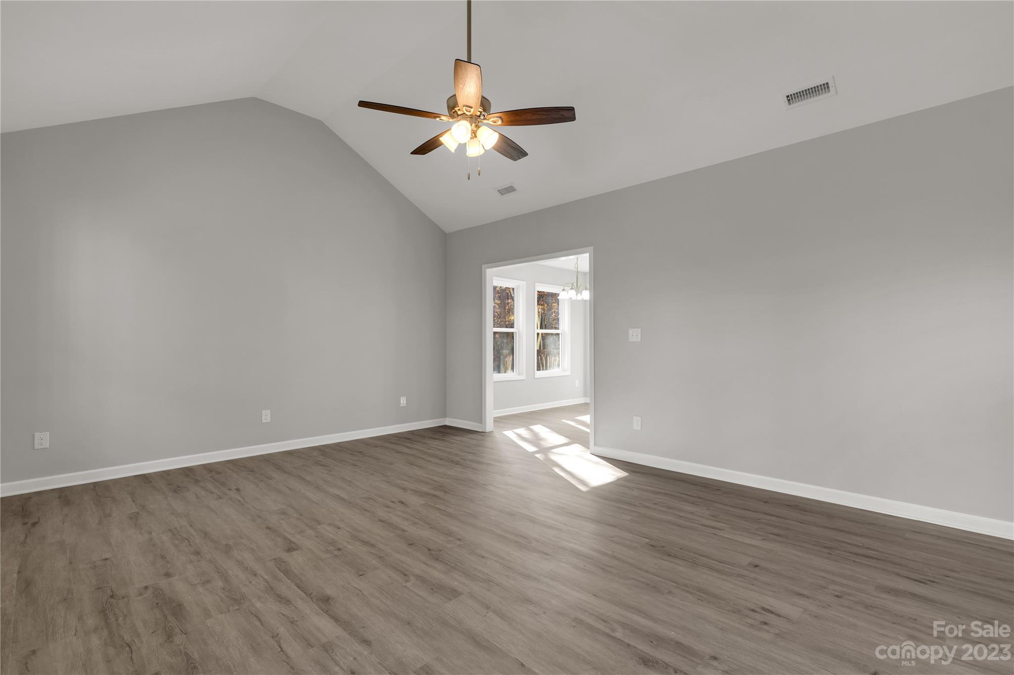 1191 Legion Road Hickory Grove, SC 29717 - Photo 10 of 32 a view of an empty room with wooden floor