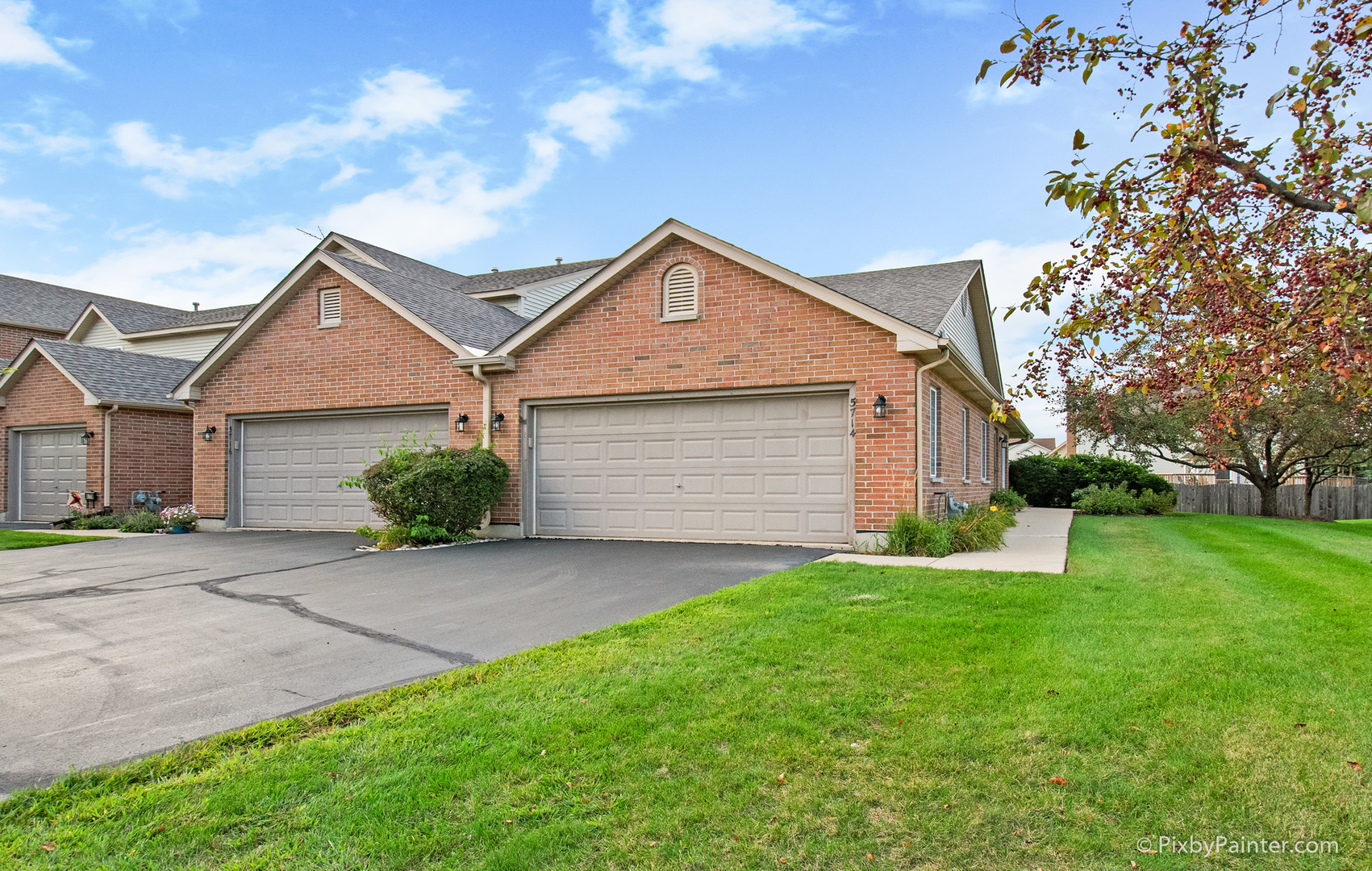 5714 Fieldstone Trail McHenry, IL 60050 - Photo 1 of 28 a front view of a house with a yard and garage