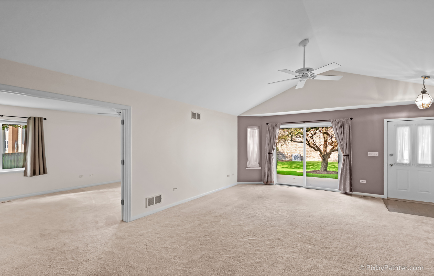 5714 Fieldstone Trail McHenry, IL 60050 - Photo 13 of 28 an empty room with windows and chandelier