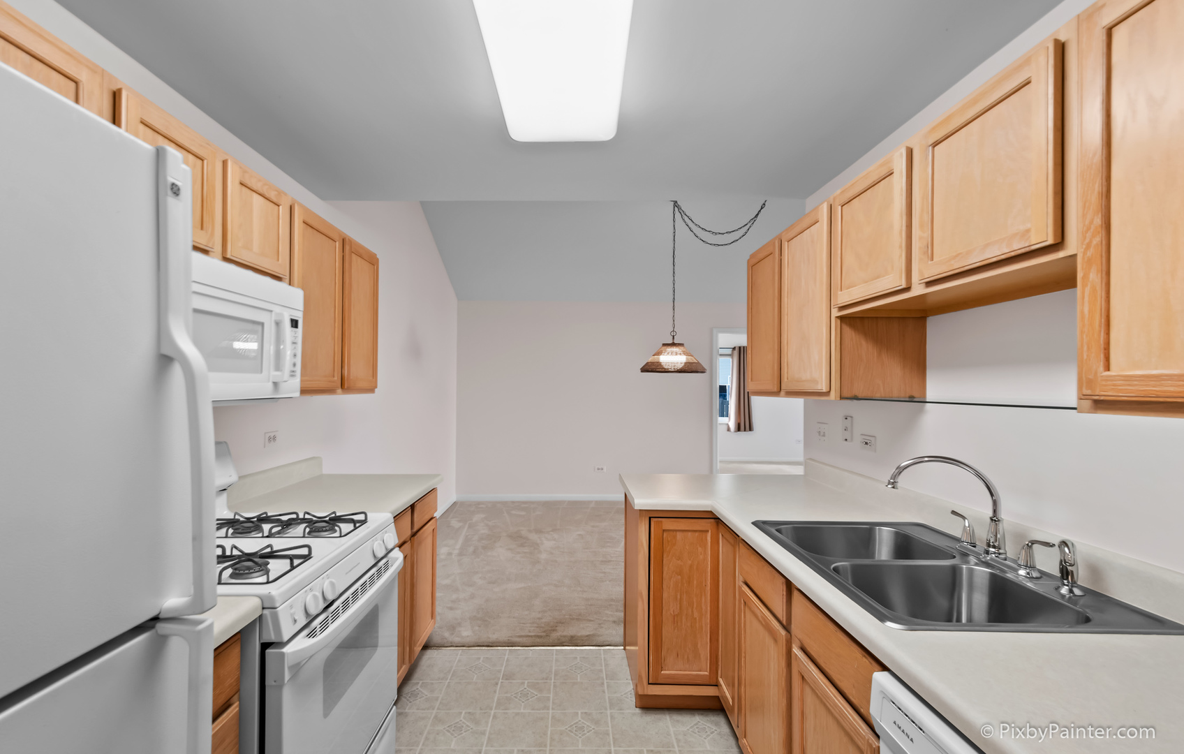 5714 Fieldstone Trail McHenry, IL 60050 - Photo 19 of 28 a kitchen with stainless steel appliances granite countertop a sink stove and refrigerator