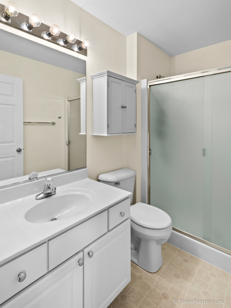 5714 Fieldstone Trail McHenry, IL 60050 - Photo 28 of 28 a bathroom with a sink toilet and shower