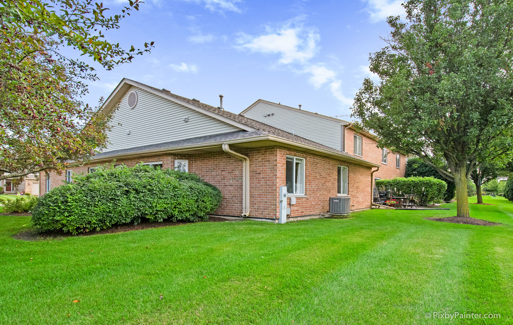 5714 Fieldstone Trail McHenry, IL 60050 - Photo 4 of 28 a front view of a house with a garden and plants