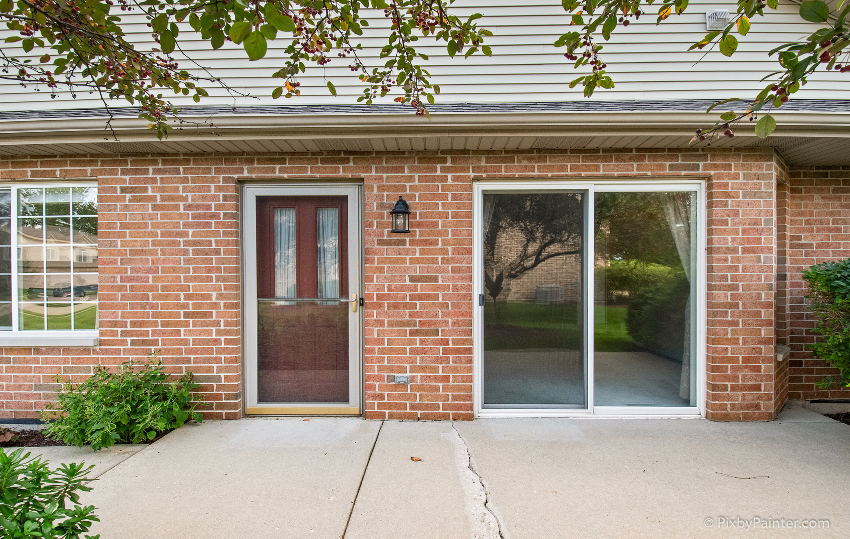 5714 Fieldstone Trail McHenry, IL 60050 - Photo 5 of 28 a view of a brick house with potted plants