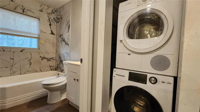 a view of wooden floor and windows in a room