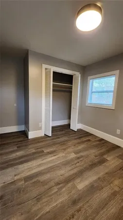 a kitchen with stainless steel appliances wooden cabinets sink and a stove