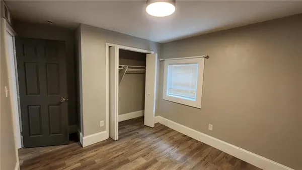a kitchen with wooden cabinets and sink