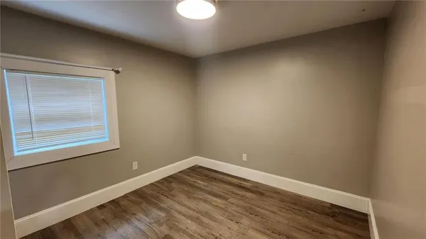 a view of hallway with wooden floor