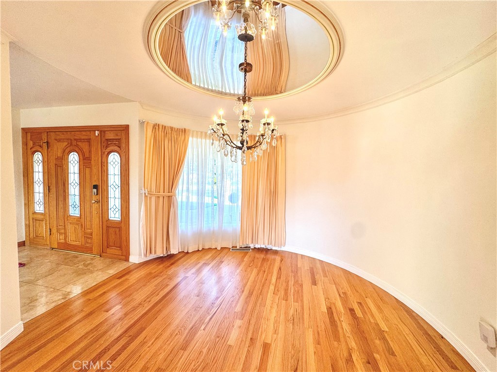 2821 Colt Road Rancho Palos Verdes, CA 90275 - Photo 12 of 42 a view of a livingroom with wooden floor and a chandelier