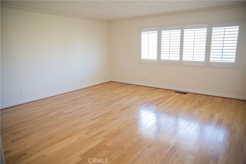 2821 Colt Road Rancho Palos Verdes, CA 90275 - Photo 15 of 42 an empty room with wooden floor and windows