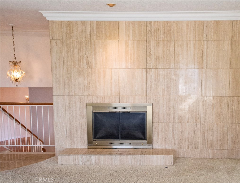 2821 Colt Road Rancho Palos Verdes, CA 90275 - Photo 17 of 42 a living room with a fireplace and a ceiling fan