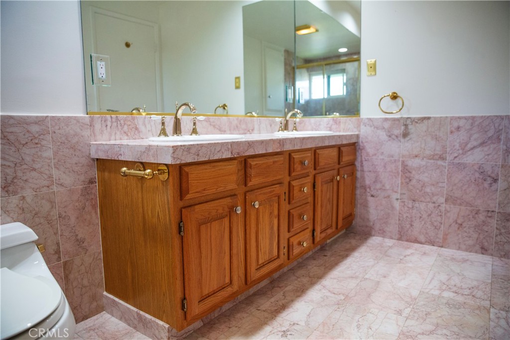 2821 Colt Road Rancho Palos Verdes, CA 90275 - Photo 21 of 42 a bathroom with a double vanity sink and a mirror