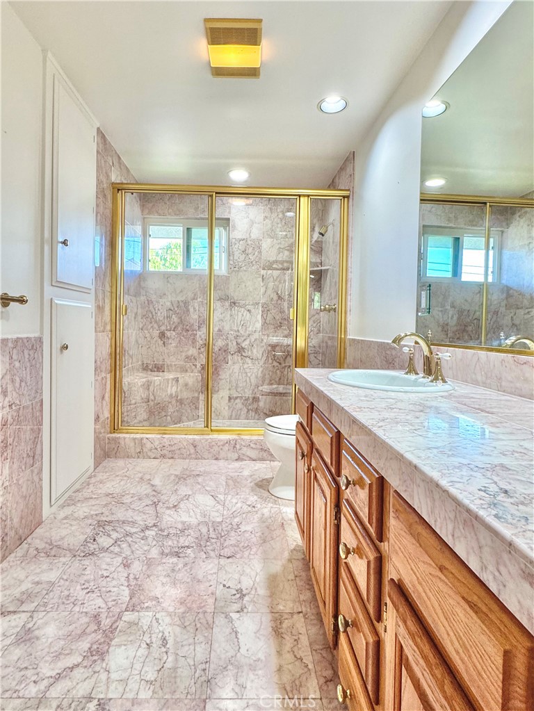 2821 Colt Road Rancho Palos Verdes, CA 90275 - Photo 22 of 42 a spacious bathroom with a granite countertop sink and a large mirror