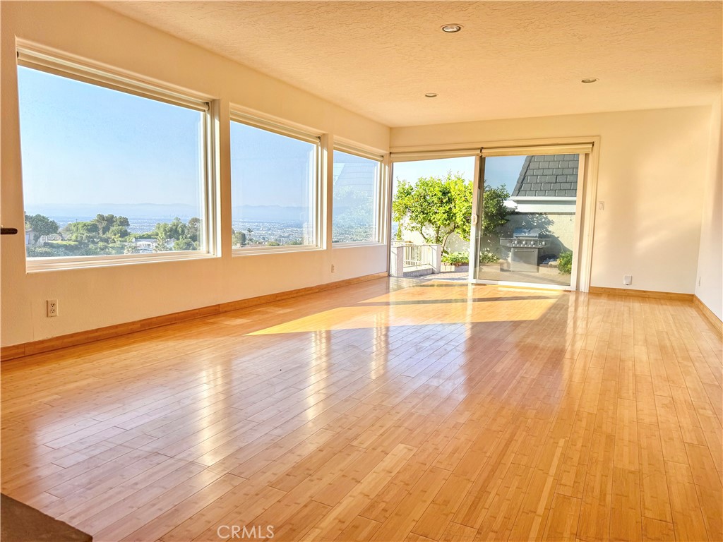 2821 Colt Road Rancho Palos Verdes, CA 90275 - Photo 24 of 42 a view of an empty room with wooden floor and a window