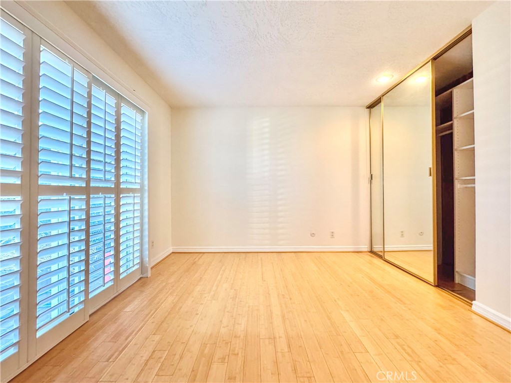 2821 Colt Road Rancho Palos Verdes, CA 90275 - Photo 31 of 42 a view of an empty room with wooden floor and a window