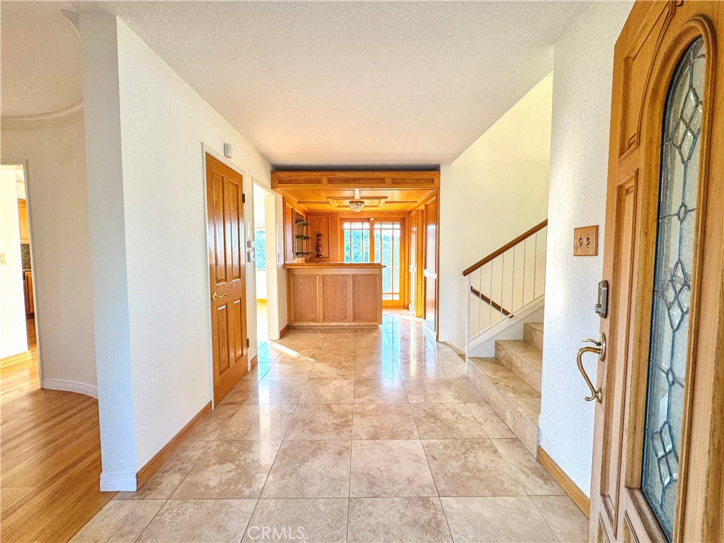 2821 Colt Road Rancho Palos Verdes, CA 90275 - Photo 4 of 42 a view of a hallway with wooden floor and glass door