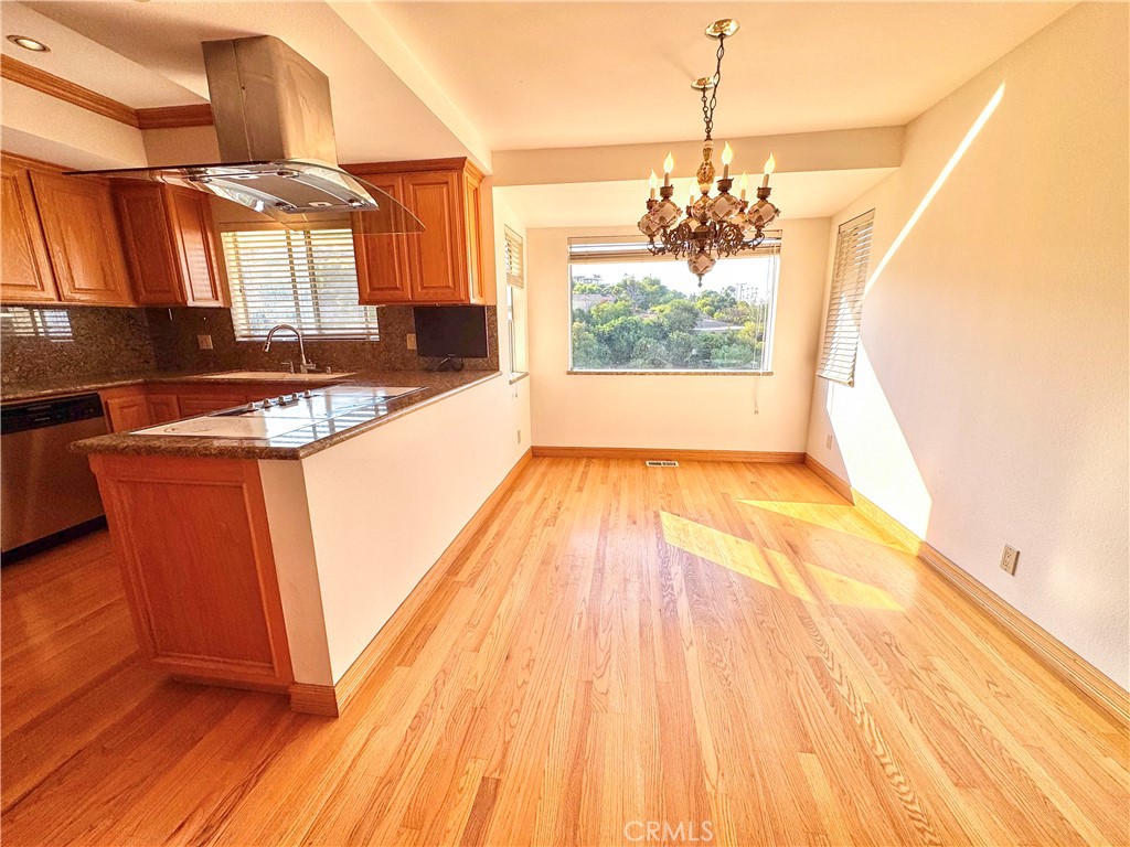 2821 Colt Road Rancho Palos Verdes, CA 90275 - Photo 8 of 42 a view of a kitchen with a sink and wooden floor