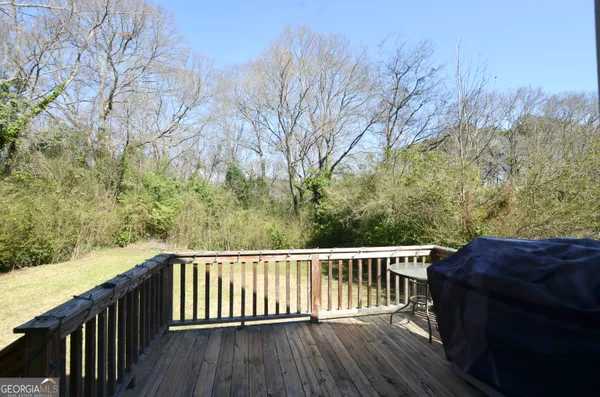 a balcony with wooden fence and floor