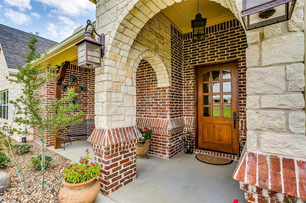 a view of a chairs and table in the balcony