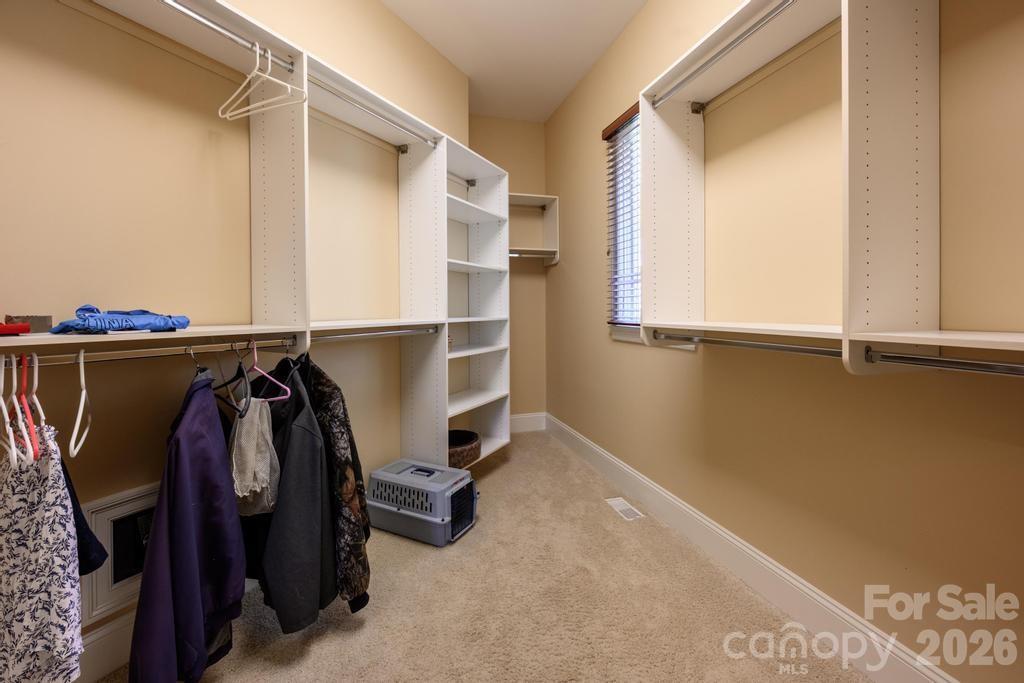 7315 Bay Ridge Drive Denver, NC 28037 - Photo 36 of 39 a view of walk in closet with clothes and shoes