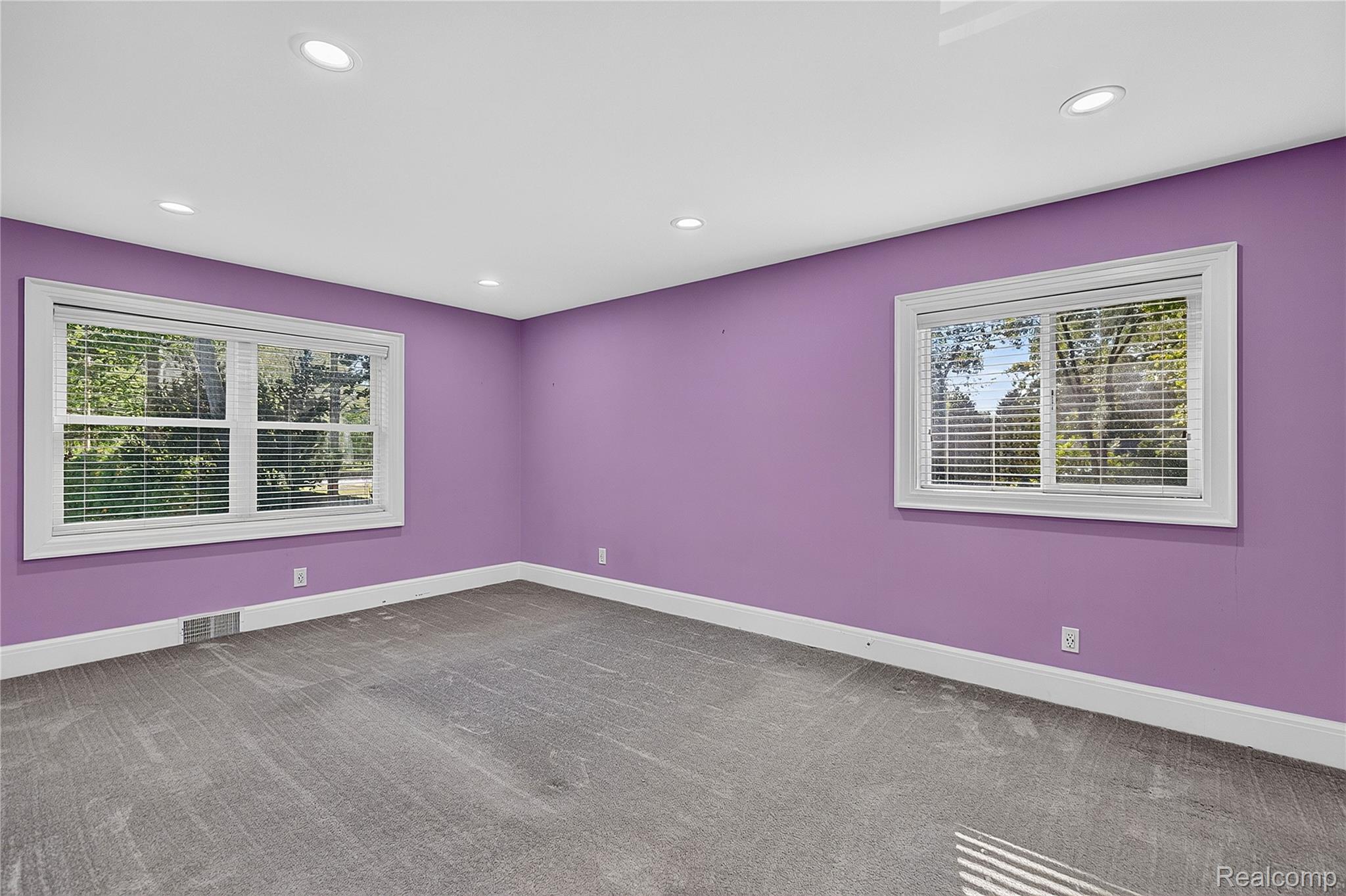 15879 Millar Road Clinton Township, MI 48036 - Photo 24 of 65 Recessed ceiling lighting with two windows and white trim