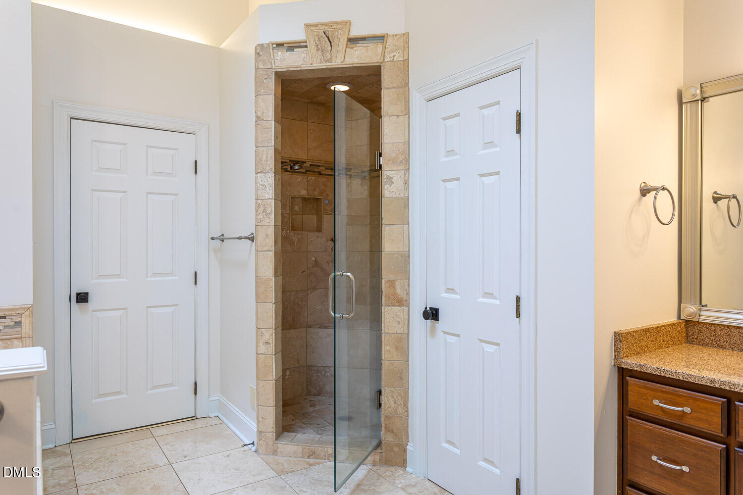 8509 Towneley Place Raleigh, NC 27615 - Photo 20 of 36 a view of a bathroom with a shower and closet