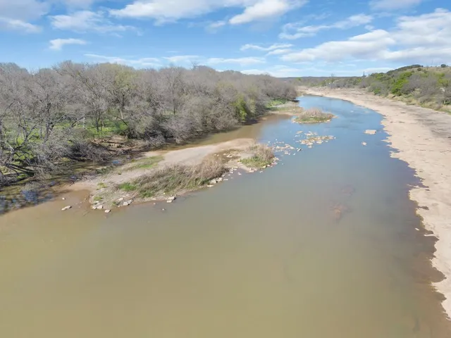 a view of a lake with mountains in the background