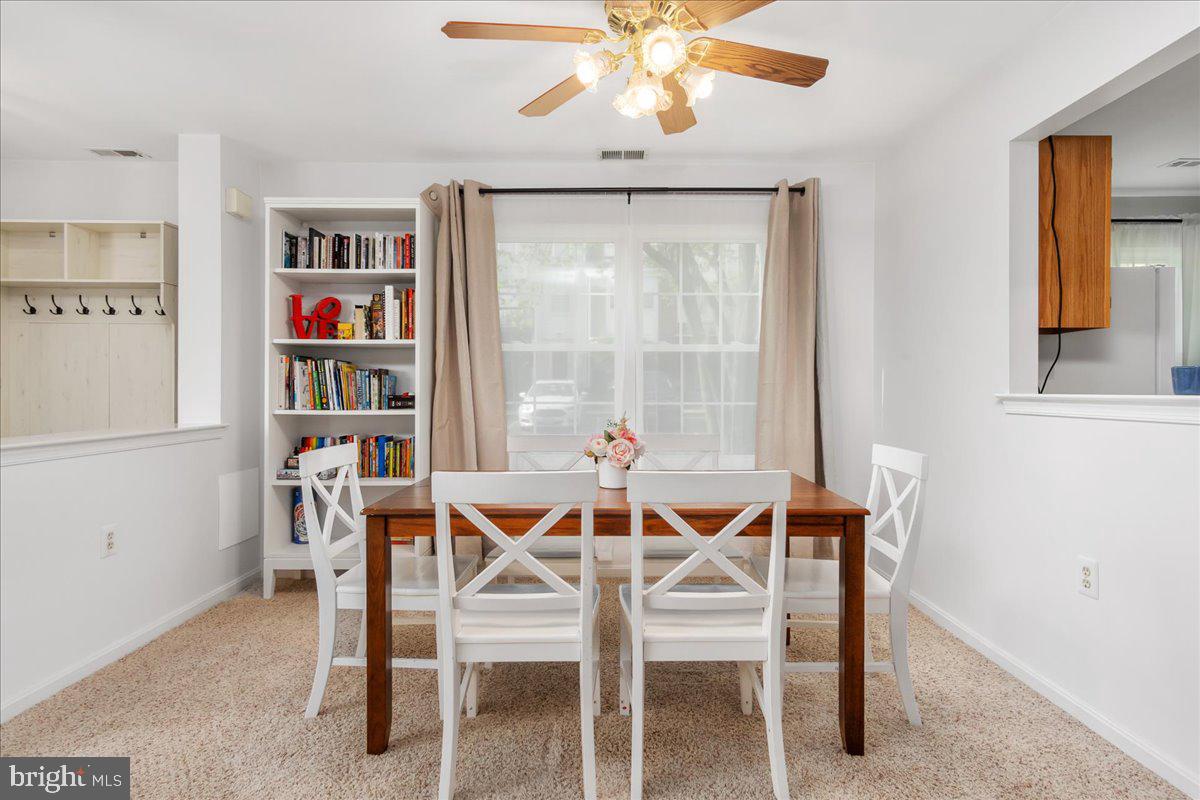 2610 Warren Way, Unit 37 Frederick, MD 21701 - Photo 11 of 42 a dining room with furniture and a window