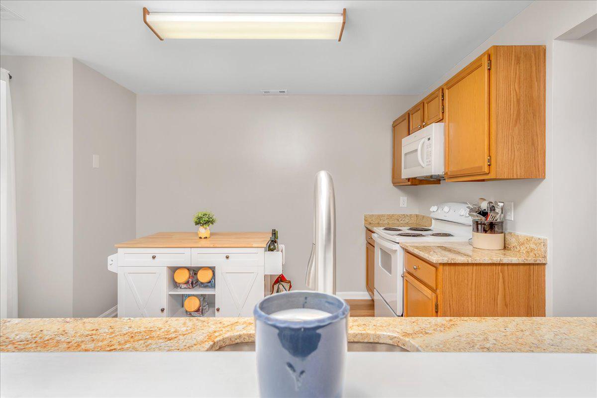 2610 Warren Way, Unit 37 Frederick, MD 21701 - Photo 13 of 42 a kitchen with a stove a sink and a refrigerator
