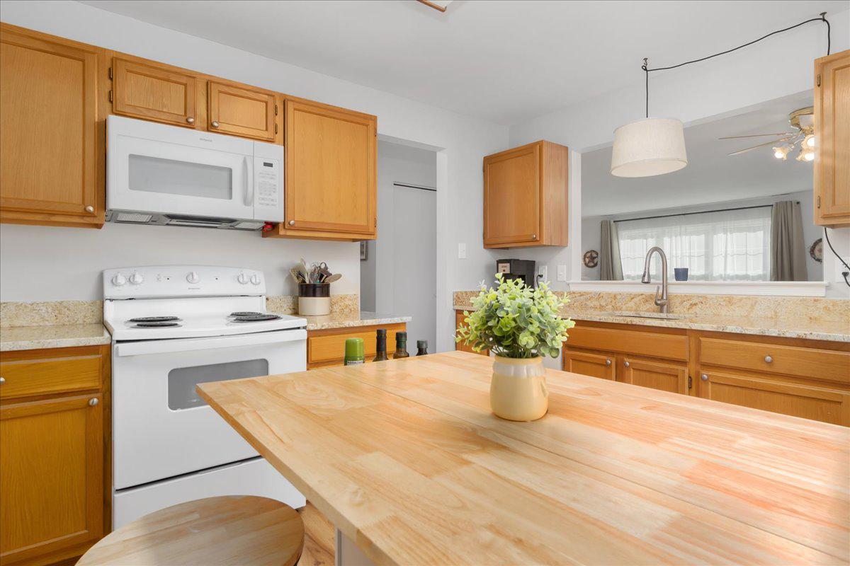 2610 Warren Way, Unit 37 Frederick, MD 21701 - Photo 17 of 42 a kitchen with a stove a sink and a refrigerator