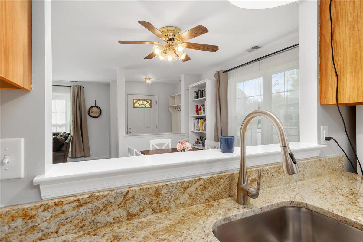 2610 Warren Way, Unit 37 Frederick, MD 21701 - Photo 18 of 42 a bathroom with a granite countertop sink a large mirror and shower